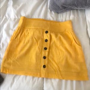 Yellow mini skirt with pockets